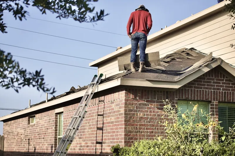 Professional roofer working on a residential roof in La Canada Flintridge